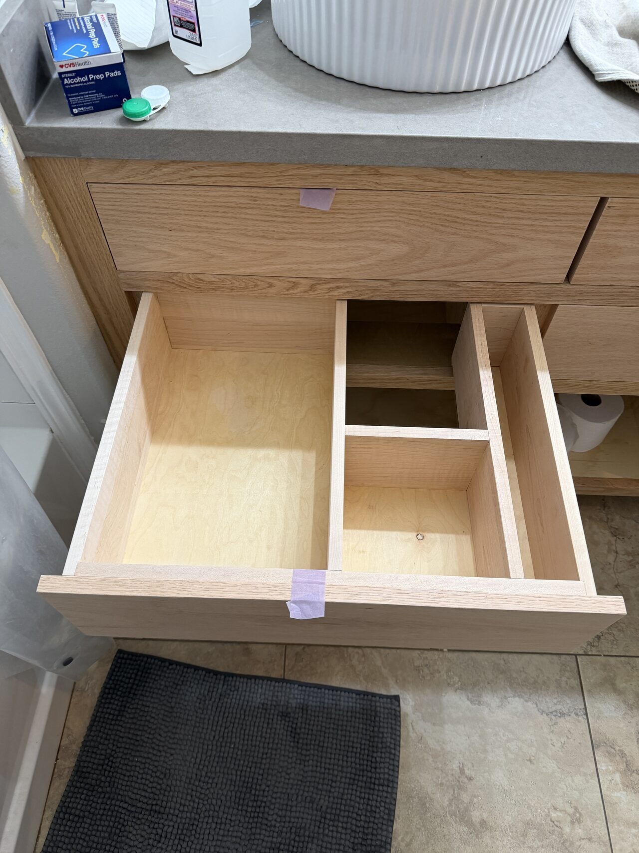 Drawer box and interior divider review showing drawer fit, slide clearance, and finish-ready cabinet construction for a Joel Hodge project.