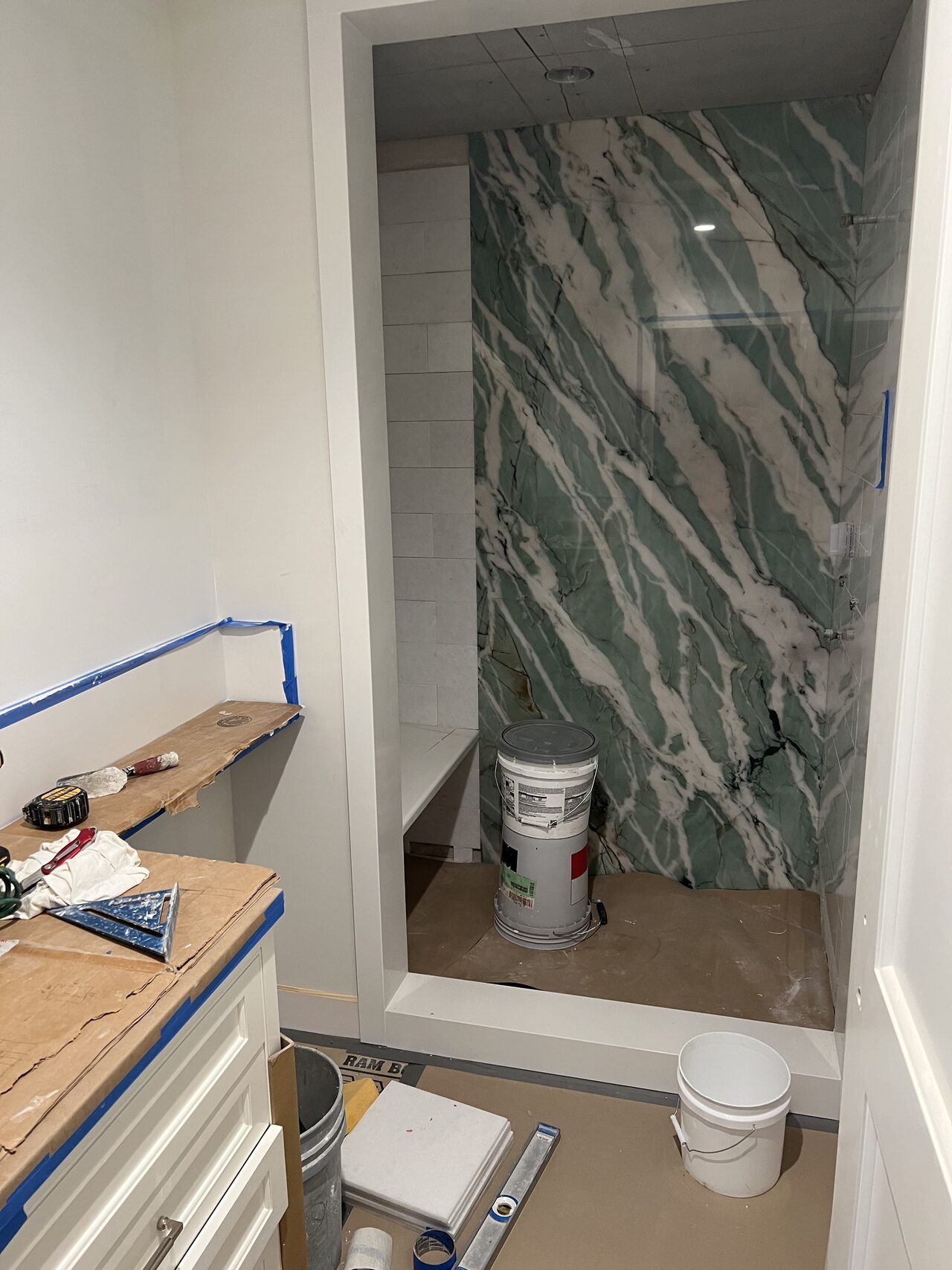 Shower wall, tub edge, and vanity-side transition checked for clean finish lines and practical access clearances for a Joel Hodge project.