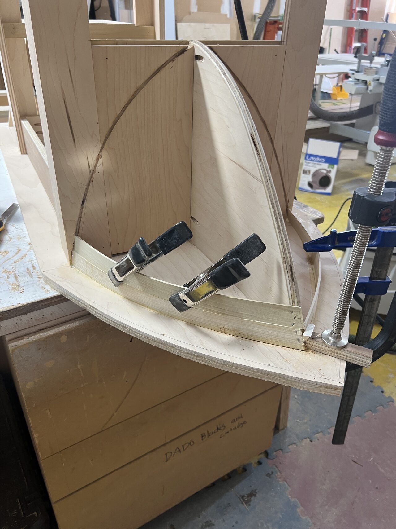 Clamped radius assembly showing the curved end profile before final shaping and sanding for a Joel Hodge project.