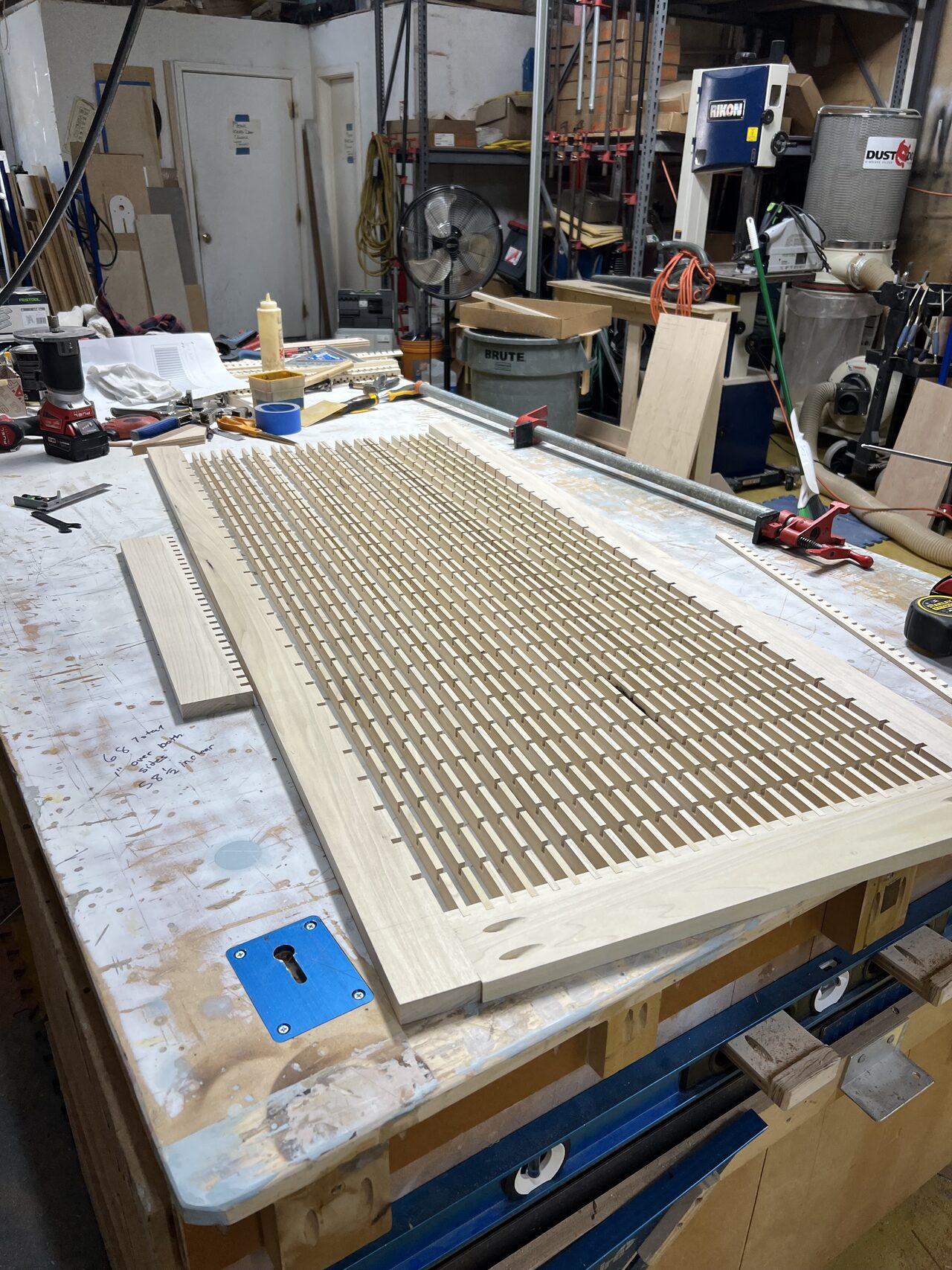 Slatted gate panel laid out on the shop bench so spacing and square could be checked before fastening for a Joel Hodge project.