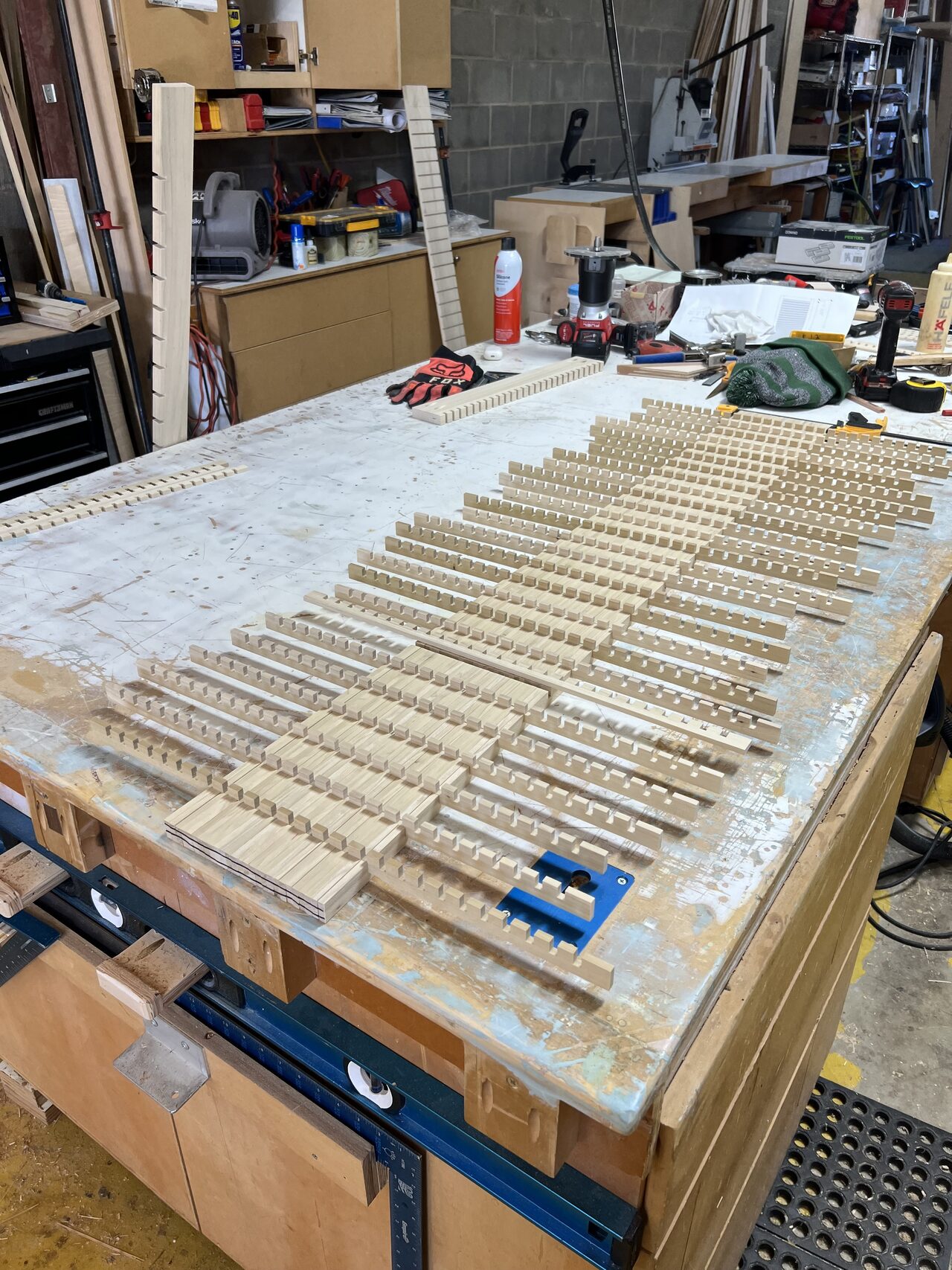 Rails and vertical strips arranged for the panel pattern before the custom gate was assembled for a Joel Hodge project.