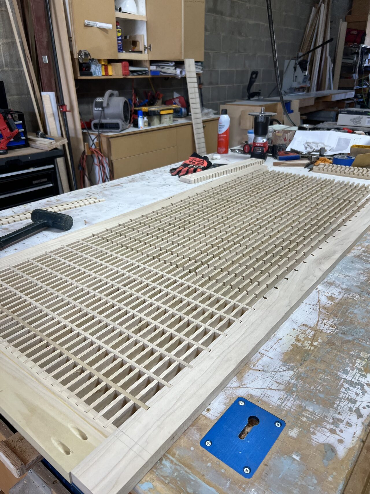 Close view of the slatted panel grid showing spacing, fastener layout, and wood pattern alignment for a Joel Hodge project.