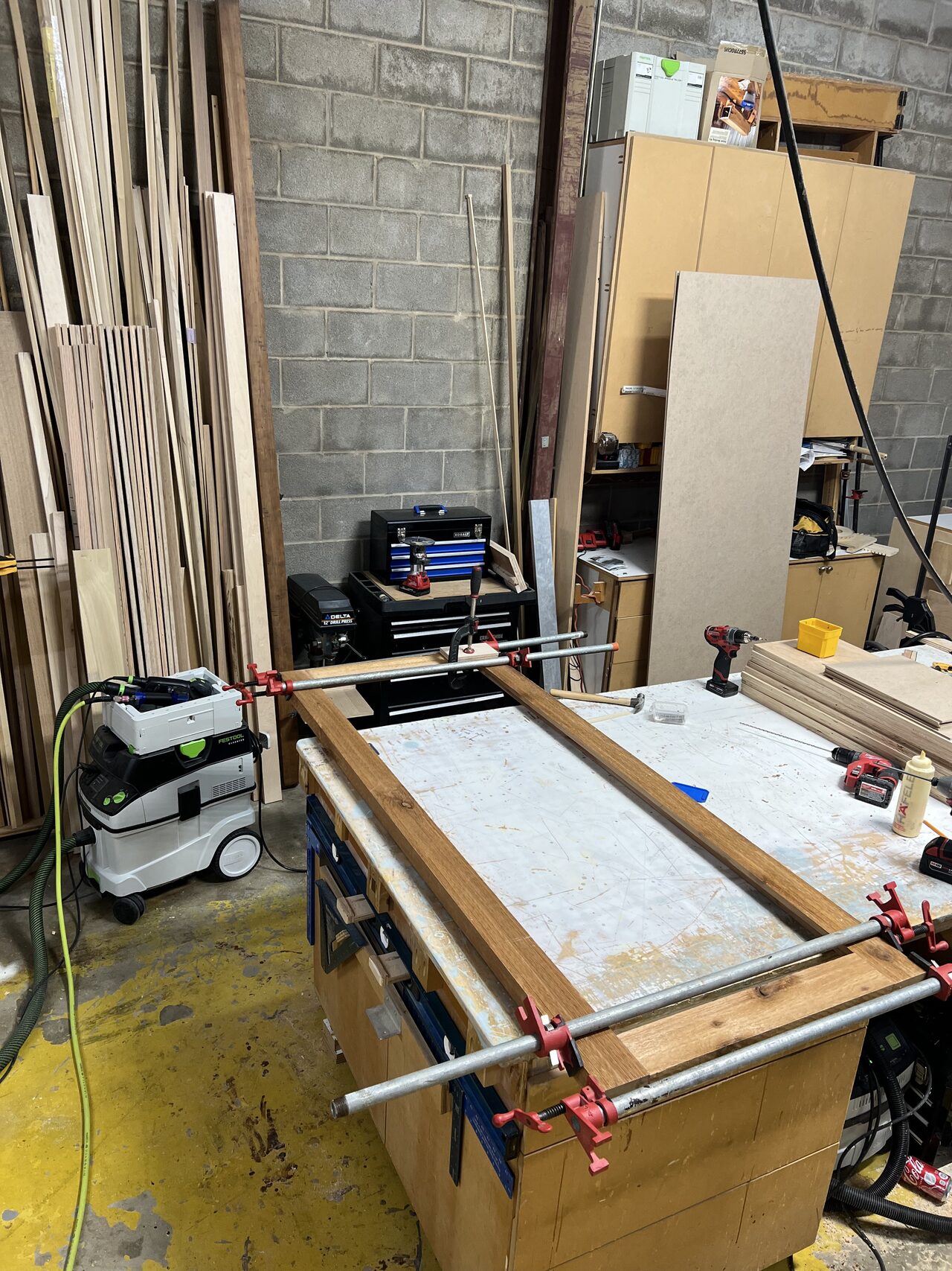 Long exterior rails and stiles clamped on the bench while the gate frame was squared for a Joel Hodge project.