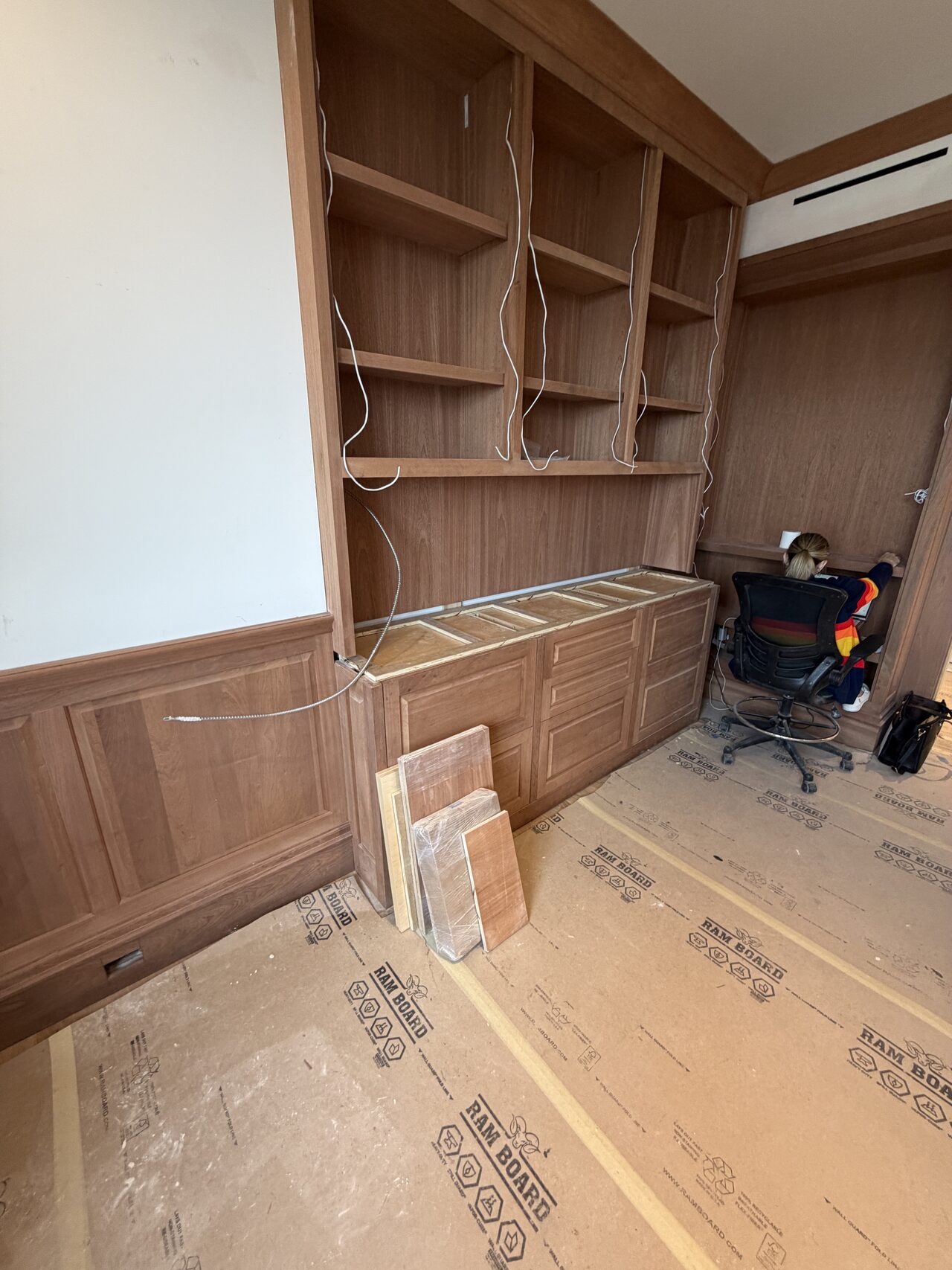 Side-wall built-in shelving and drawer run reviewed for consistent spacing and trim integration for a Joel Hodge project.