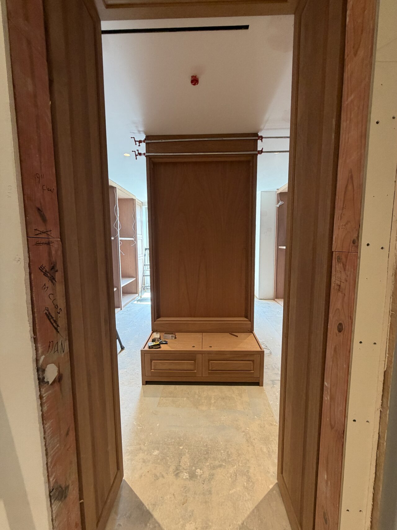 Finished central pedestal and built-in view through the doorway after room cleanup and fit review for a Joel Hodge project.