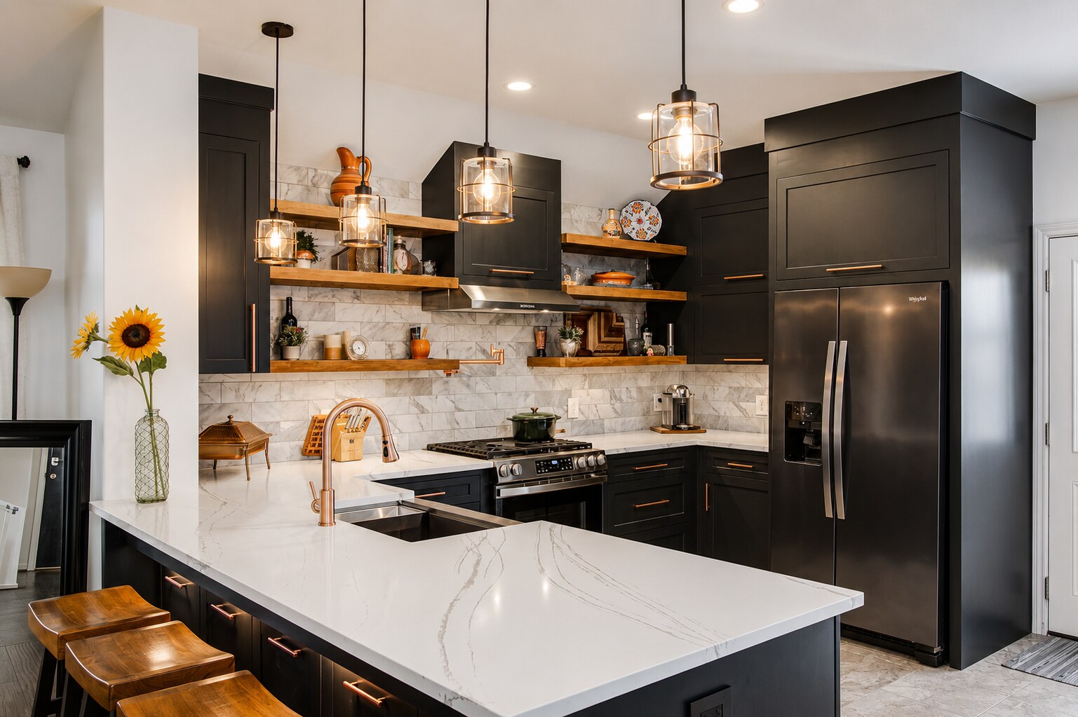 Finished dark kitchen angle with island, range wall, wood shelves, refrigerator panels, and pendant lights.