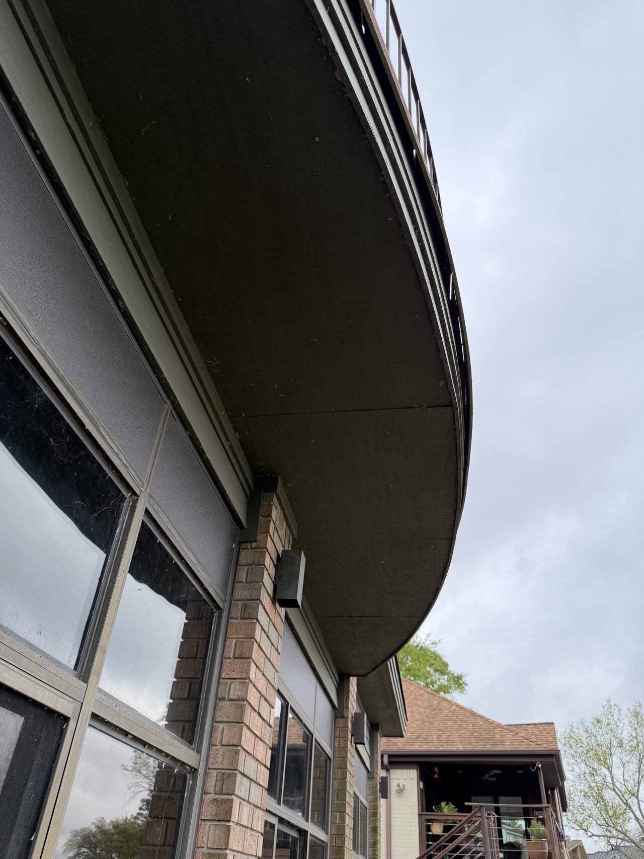 Curved eave and window head detail checked for soffit, trim, and roofline coordination for a Joel Hodge project.