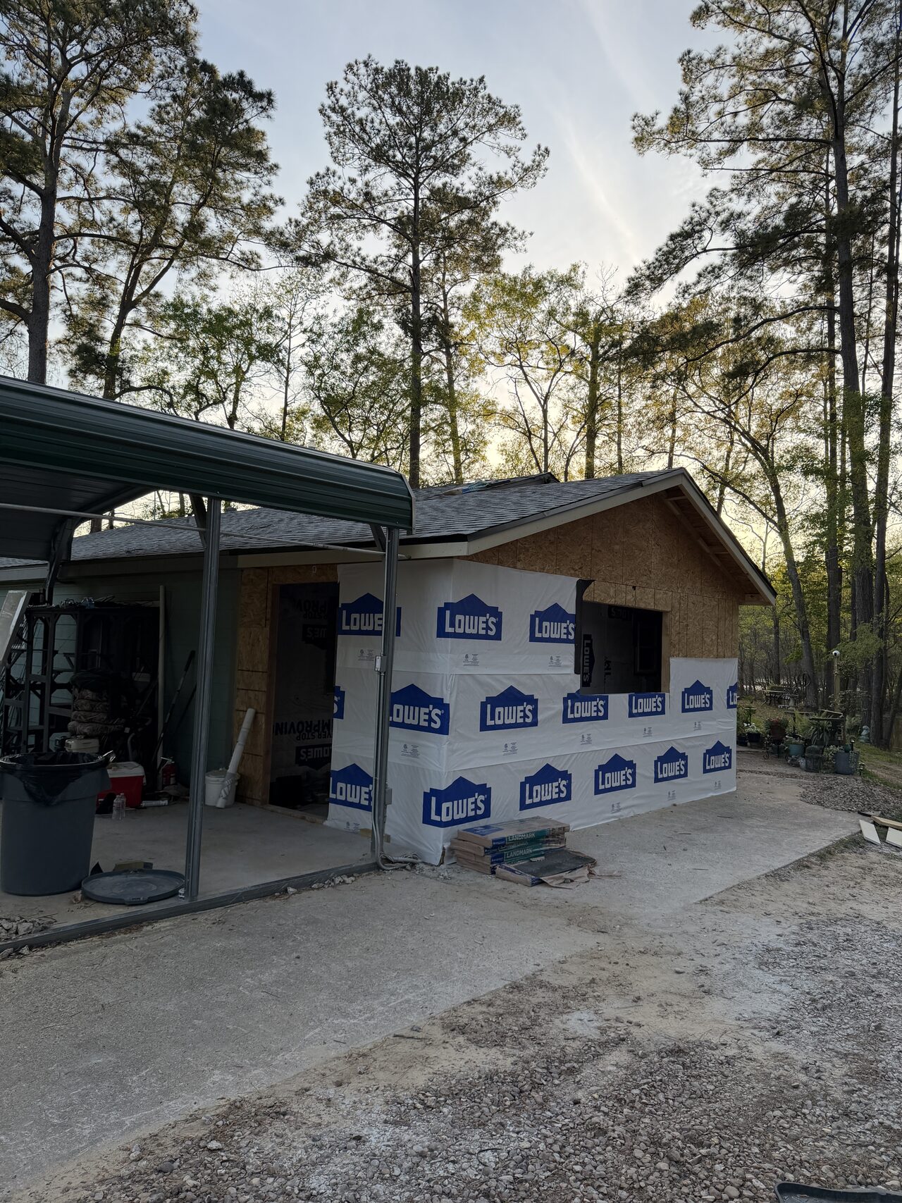 Exterior wall after sheathing and weather barrier work around the opening for a Joel Hodge project.