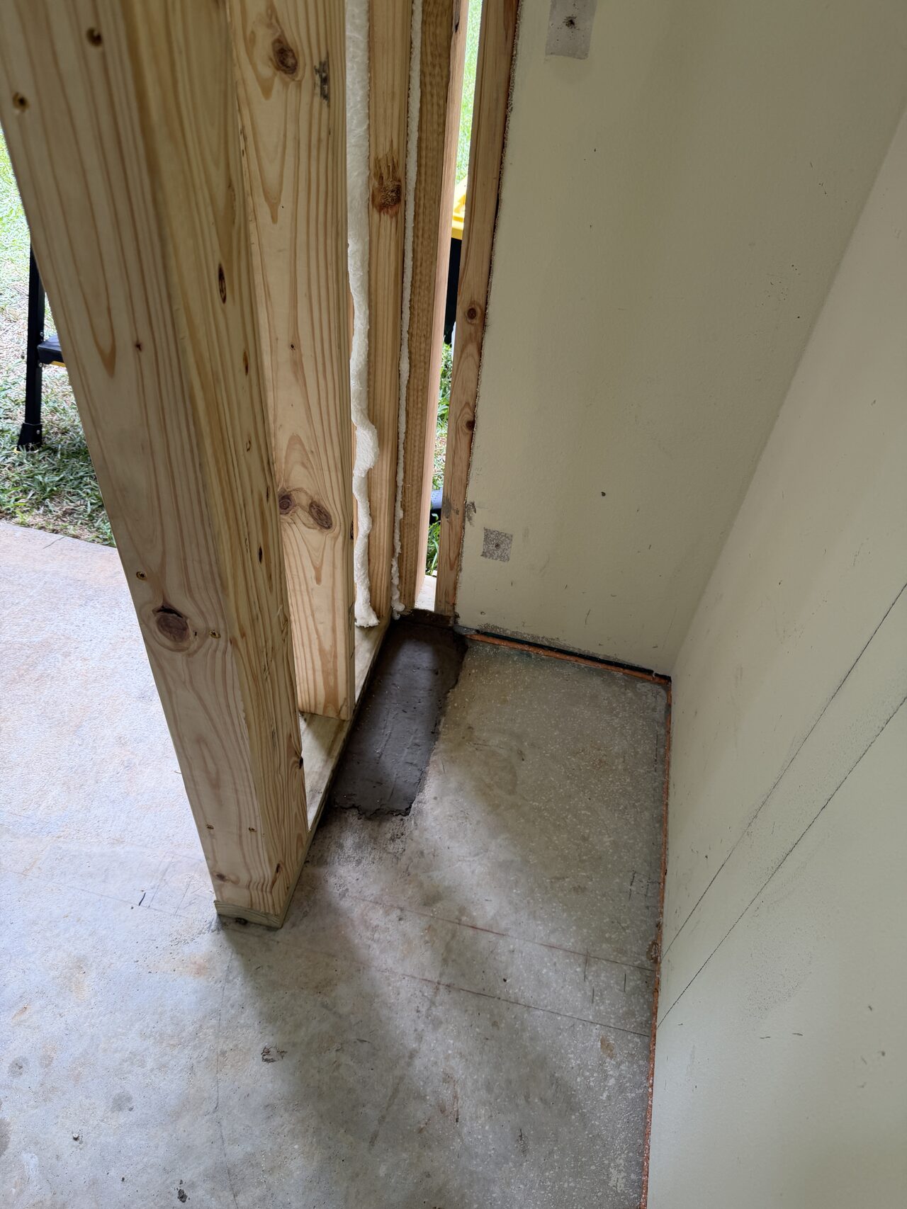 Jamb bottom and threshold shim detail checked for proper support and clean finish alignment for a Joel Hodge project.