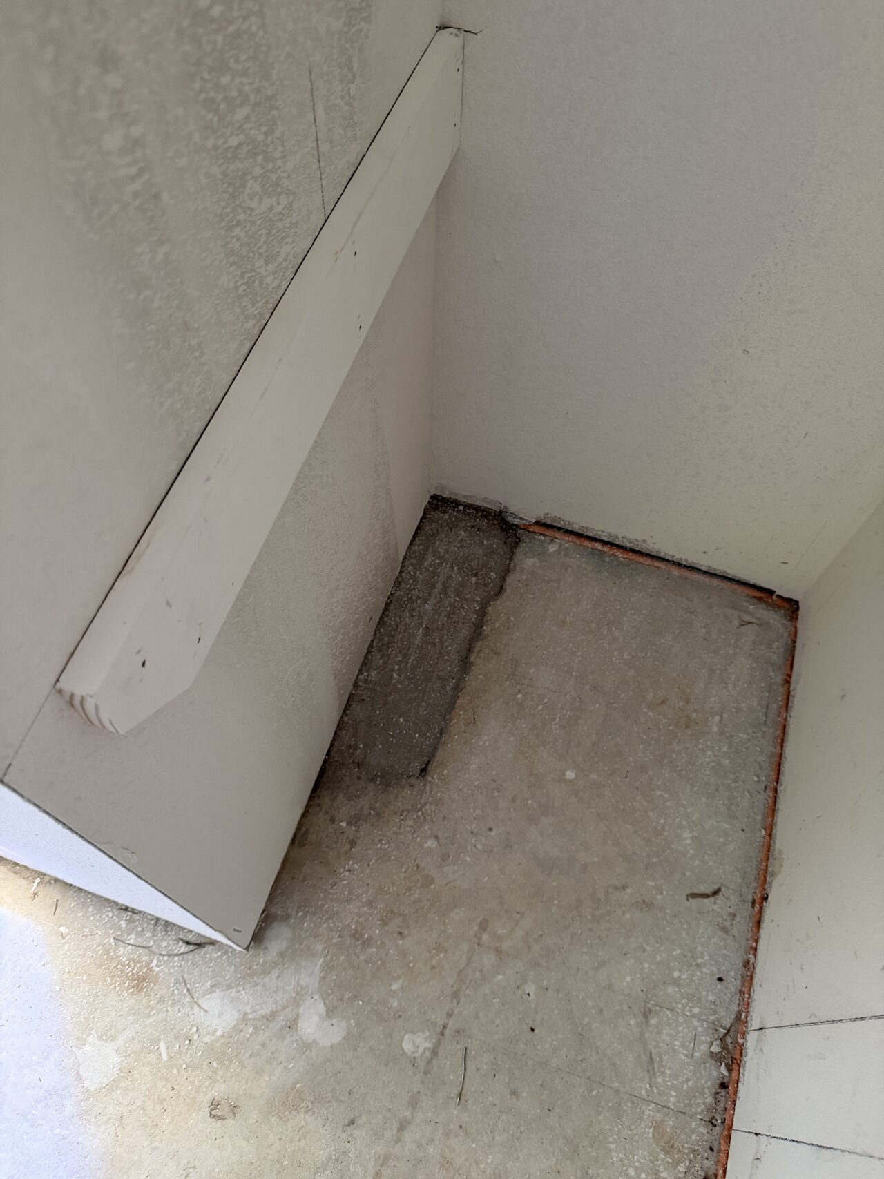 Baseboard and inside-corner trim detail reviewed at the floor line for tight fit for a Joel Hodge project.