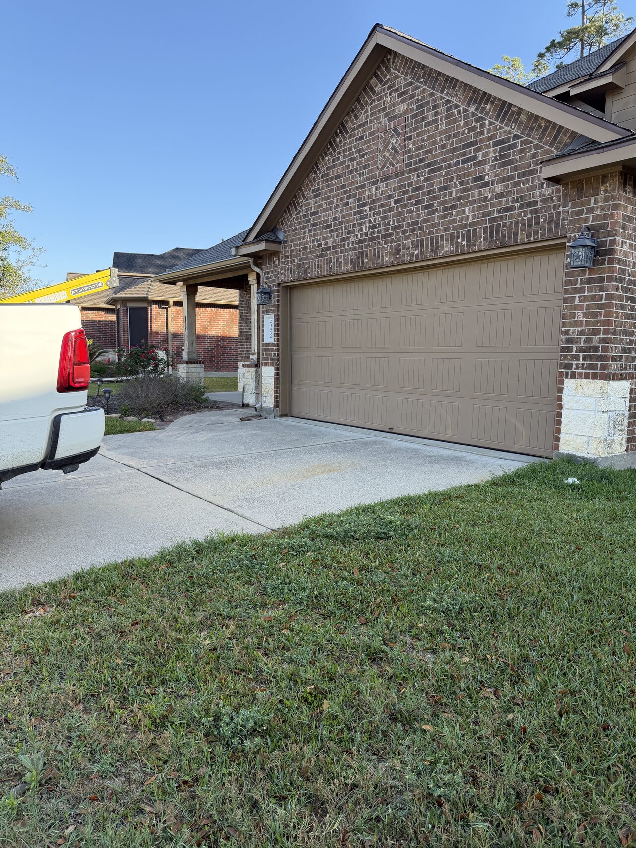 Front driveway approach documented for exterior access and entry work staging for a Joel Hodge project.