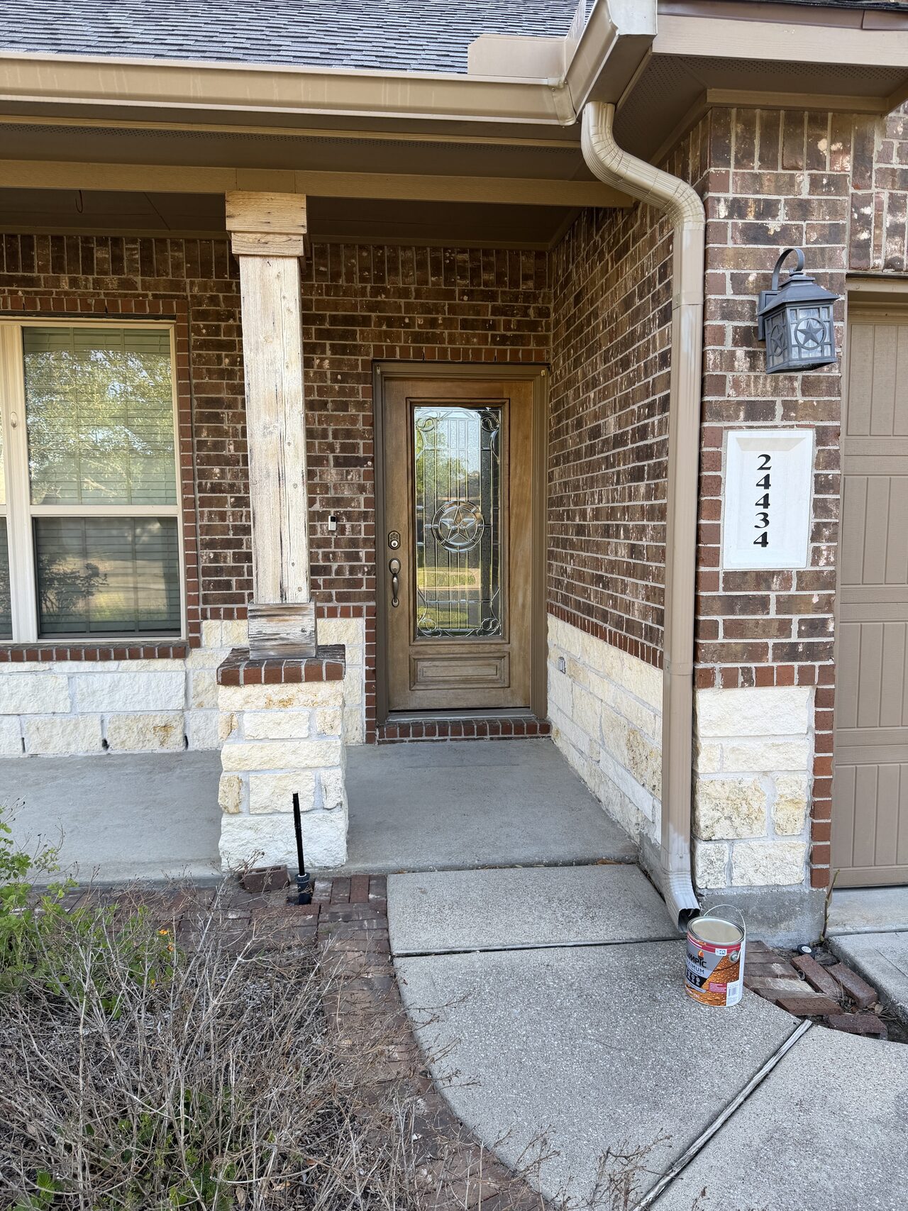 Front porch, columns, and entry door condition reviewed before finish work began for a Joel Hodge project.
