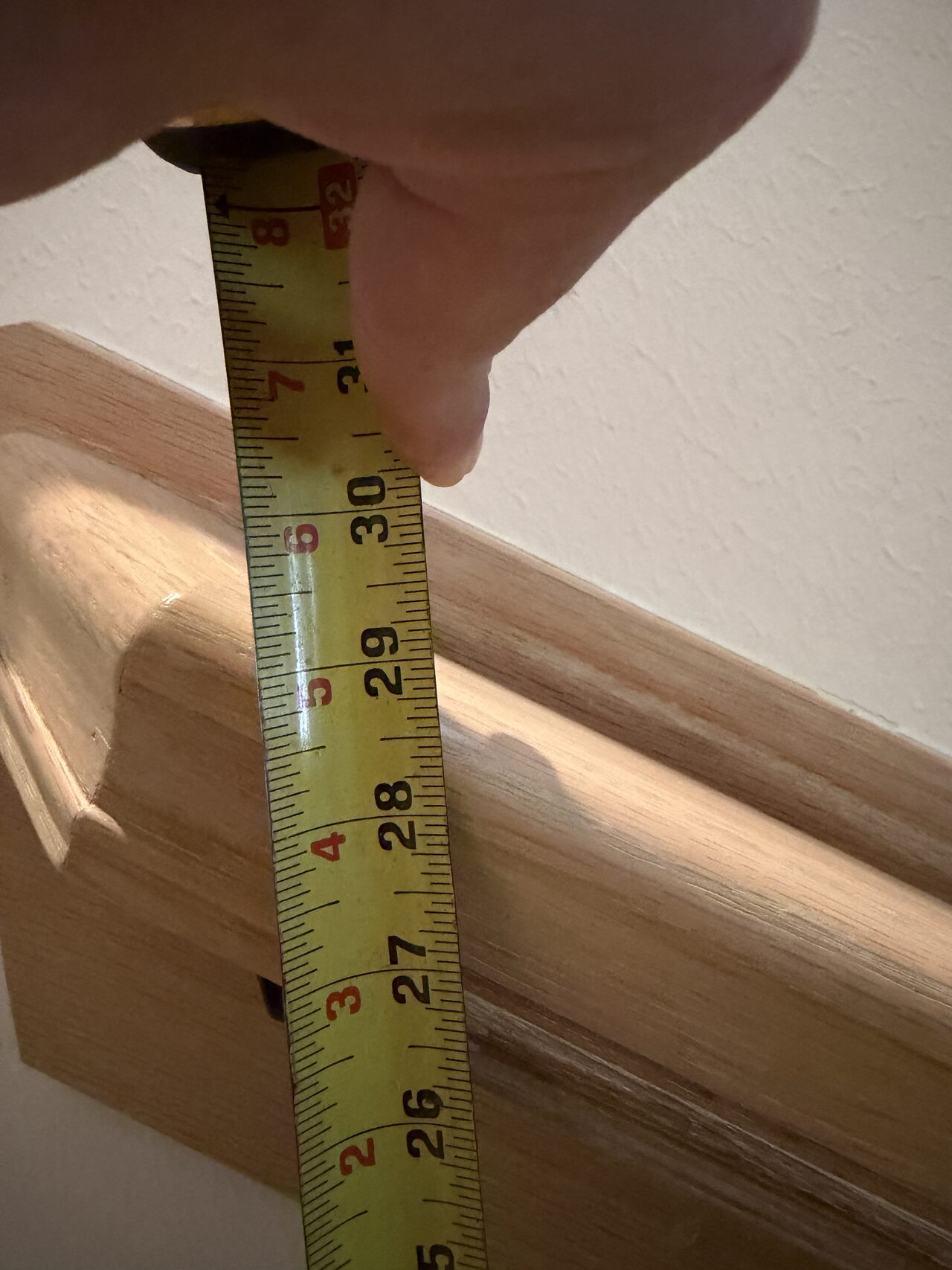 Handrail height and wall clearance measured at the stair run for fit and code-aware planning for a Joel Hodge project.