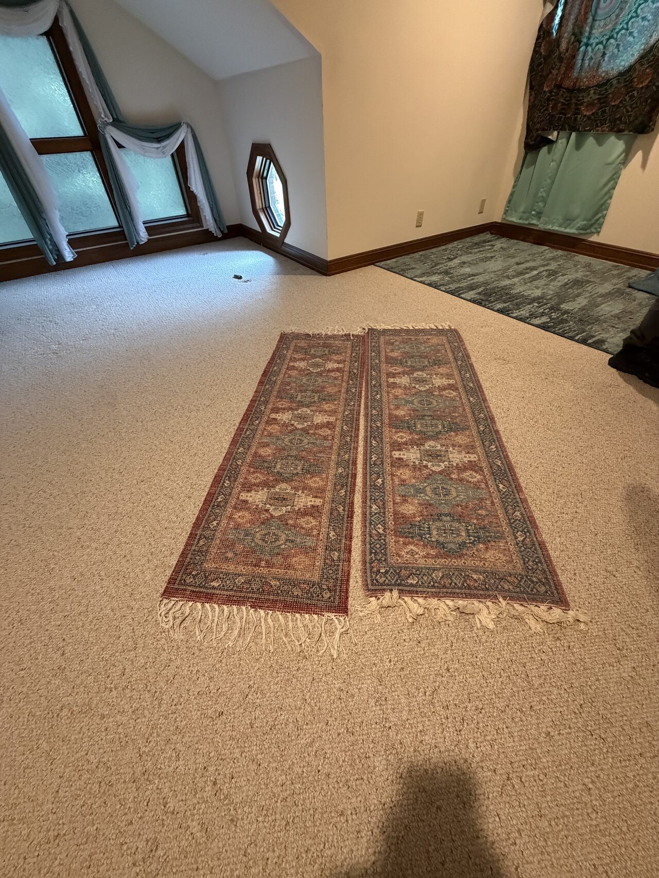 Finished carpeted room and stair landing area checked for floor transition and trim alignment for a Joel Hodge project.