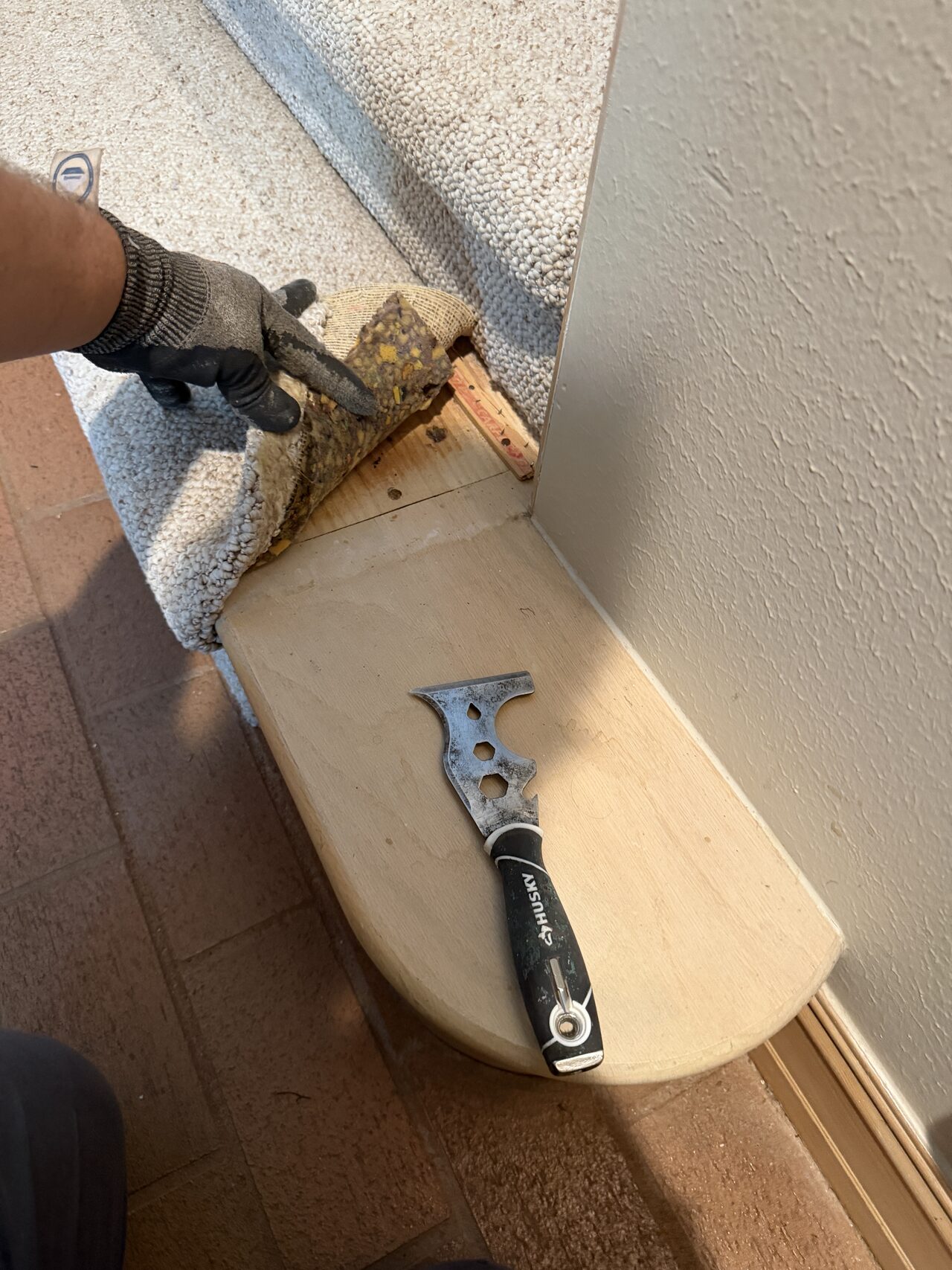 Door casing or base trim being removed or adjusted with hand tools during finish prep for a Joel Hodge project.