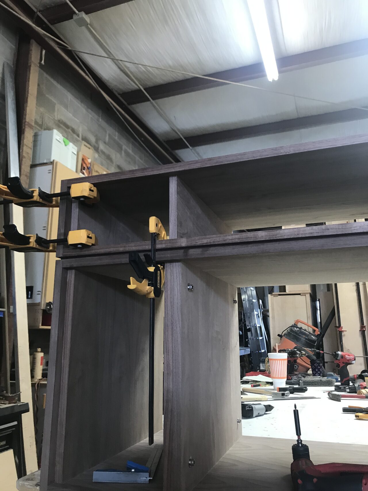 Tall side panel and cabinet frame checked upright in the shop before final box assembly for a Joel Hodge project.