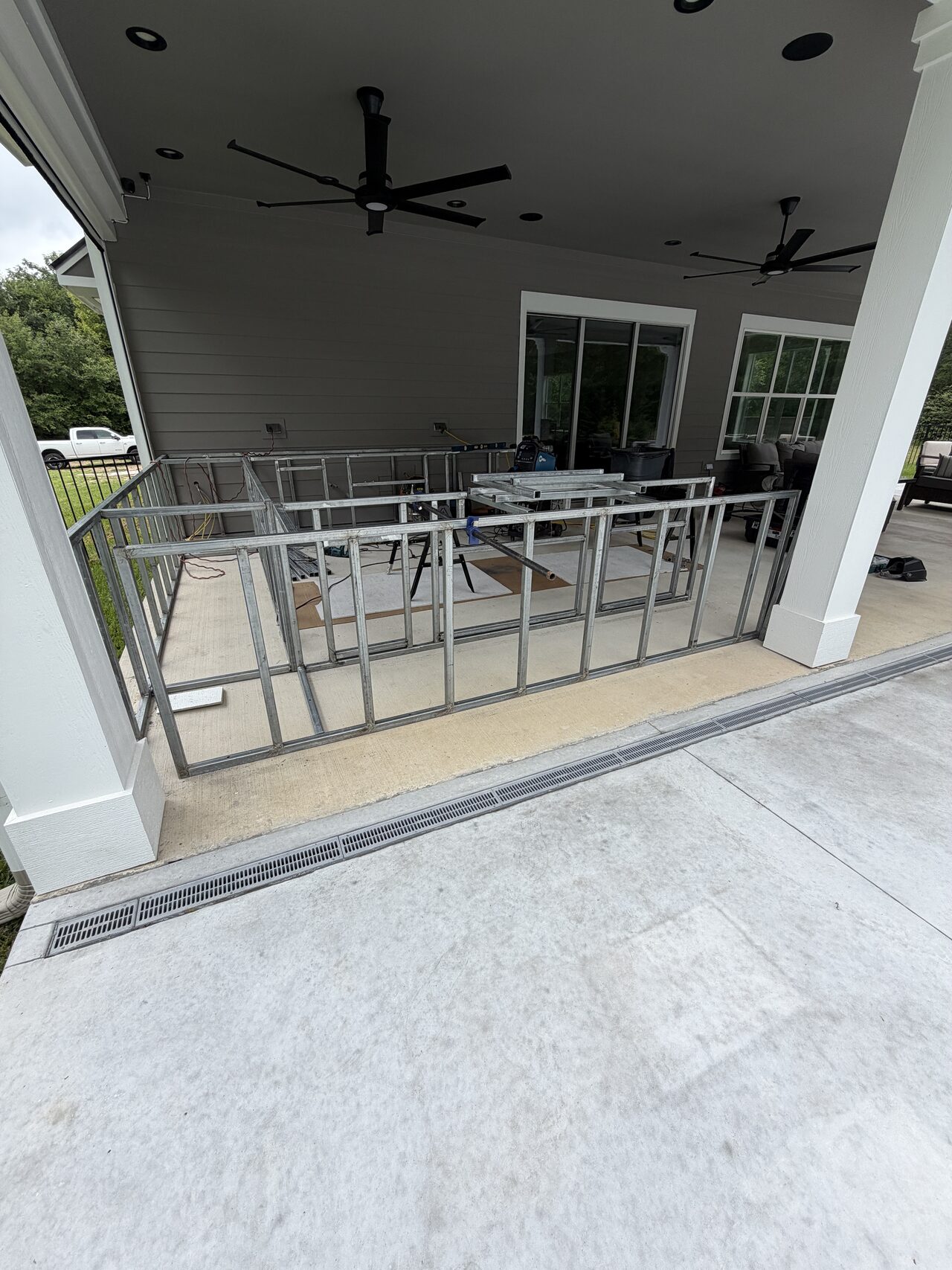 Finished patio railing section checked along the covered outdoor seating area for a Joel Hodge project.