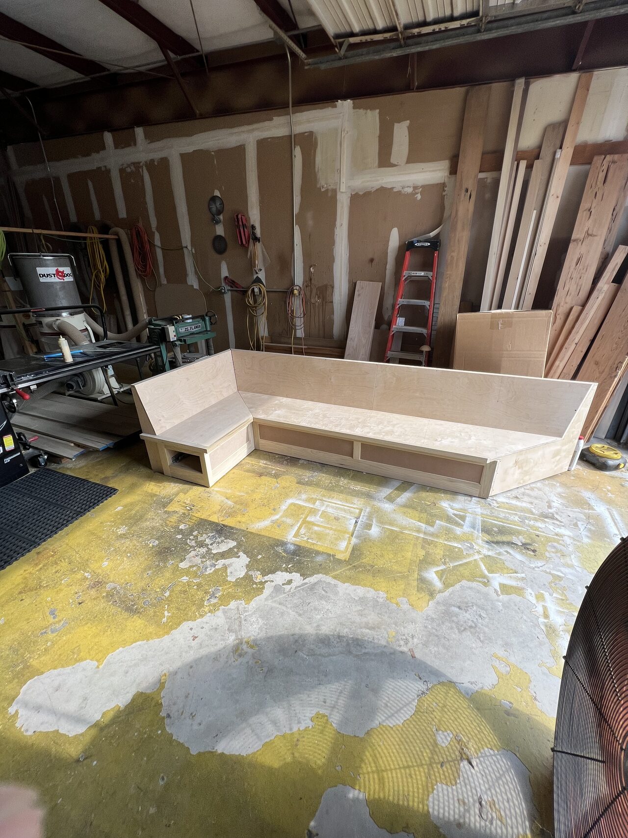 Long low base assembly in the shop before face frames, trim, and finish panels were completed for a Joel Hodge project.