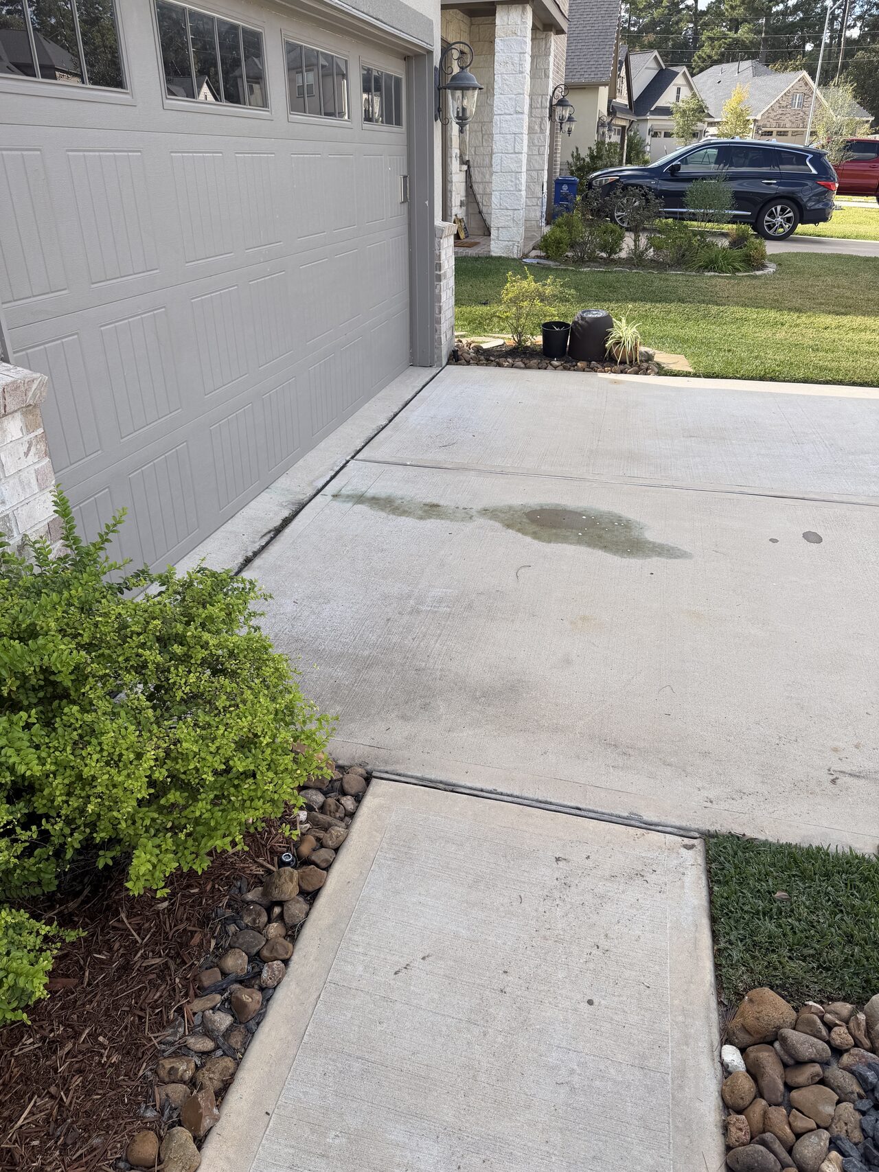 Finished concrete walkway connection near the landscape bed and house side for a Joel Hodge project.