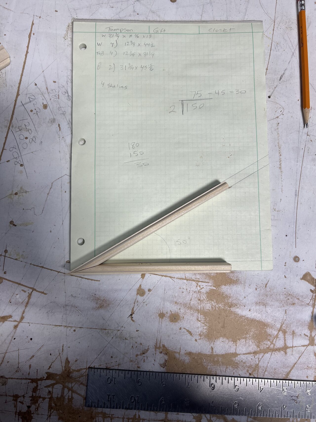 Template or panel layout marked on the bench before cutting the niche trim piece for a Joel Hodge project.